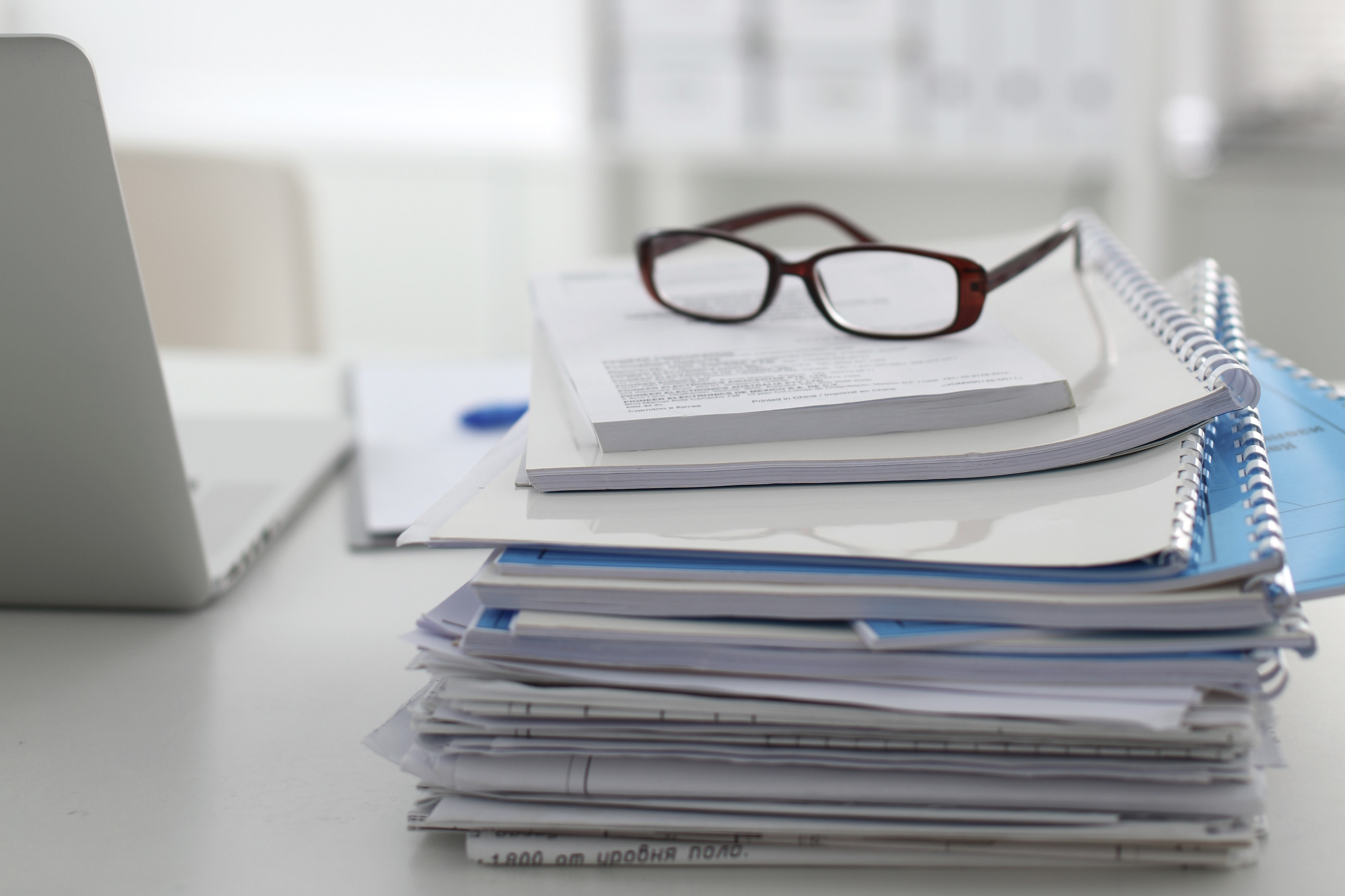  Glasses on stack of papers